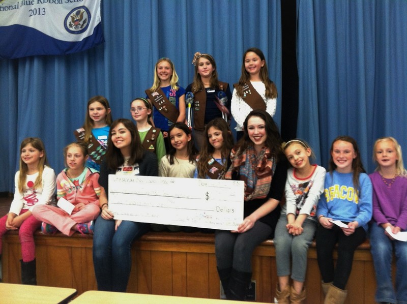 At the presentation of the check by Troop 46 to Troop 1482 are in back (l-r) Alodie Elliott, Angelina Garofalino, and Natalie Derrickson; middle row, Peyton Evans and Abigail Betts. In front are Victoria Lingo, Elle Nauman, Phoebe Callard, Terri Kirschner, Jacqueline Thomas, Hannah Lowe, Anna Nauman, Lexi Truitt and Nicole Snyder. SOURCE SUBMITTED